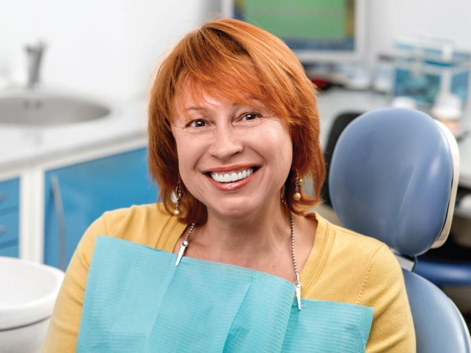 woman in dental chair smiling